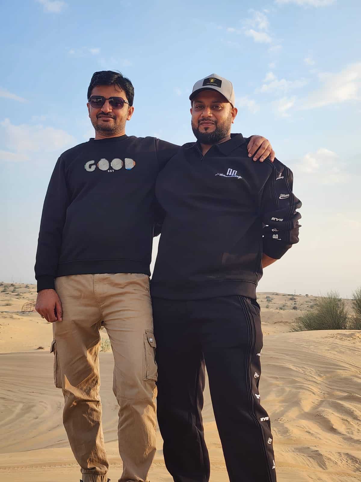 Guests experiencing traditional Arabian welcome and culture at Dubai desert safari camp.